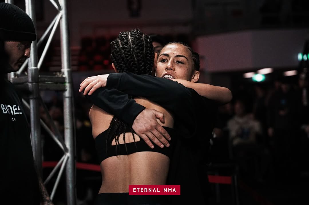 Ana Arvan embracing her coach after the decision win