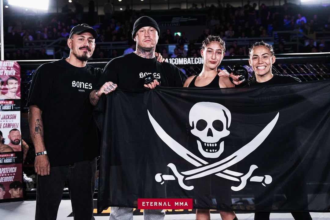 Ana Arvan with her Bones MMA team after winning at Eternal MMA 107